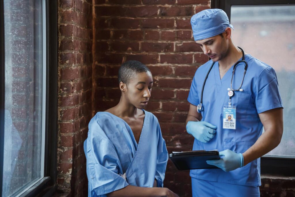 Doctor and patient in consultation at a hospital, discussing treatment.